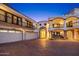 Three-car garage with Spanish-style architectural features at 5400 E Valle Vista Rd # 6, Phoenix, AZ 85018