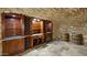 Wine cellar with wooden cabinets and stone walls at 5400 E Valle Vista Rd # 6, Phoenix, AZ 85018