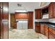 Laundry room with wood cabinets, washer, dryer, and granite countertops at 5400 E Valle Vista Rd # 6, Phoenix, AZ 85018