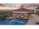 Luxury pool with waterfall feature and a covered seating area at 5400 E Valle Vista Rd # 6, Phoenix, AZ 85018