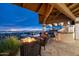 Covered outdoor kitchen with grill and fireplace, offering panoramic views at 5400 E Valle Vista Rd # 6, Phoenix, AZ 85018