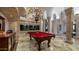 Game room features a pool table, large aquarium, and elegant chandelier at 5400 E Valle Vista Rd # 6, Phoenix, AZ 85018