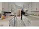 Bright kitchen with white cabinetry and tiled floors at 5400 E Valle Vista Rd # 6, Phoenix, AZ 85018