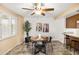 Dining area with a round table, four chairs, and a built-in bar at 8413 E Jackrabbit Rd, Scottsdale, AZ 85250