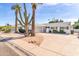 House exterior showcasing a mid-century modern design and desert landscaping at 8413 E Jackrabbit Rd, Scottsdale, AZ 85250