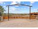 Wooden gate with a metal frame at the property entrance at 1910 W Roderick Ln, Wickenburg, AZ 85390