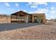 Metal barn with covered stalls and hay storage at 1910 W Roderick Ln, Wickenburg, AZ 85390