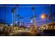 Night view of palm tree-lined street with string lights at 6833 E Osborn Rd # D, Scottsdale, AZ 85251