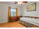 Bedroom with daybed and dresser, featuring a window with curtains at 5534 W Tierra Buena Ln, Glendale, AZ 85306