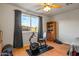 Bright bedroom with exercise equipment and large window at 5534 W Tierra Buena Ln, Glendale, AZ 85306