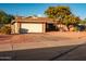 Brick ranch home with attached garage and mature landscaping at 5534 W Tierra Buena Ln, Glendale, AZ 85306