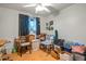 A bedroom with wood flooring and a ceiling fan, currently filled with boxes at 5534 W Tierra Buena Ln, Glendale, AZ 85306