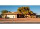 Brick ranch home with attached garage and mature landscaping at 5534 W Tierra Buena Ln, Glendale, AZ 85306