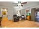Relaxing living room featuring two recliners and a fish tank at 5534 W Tierra Buena Ln, Glendale, AZ 85306