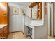 Bathroom features a vanity with storage and a large mirror at 5534 W Tierra Buena Ln, Glendale, AZ 85306