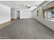 Large living room featuring carpeted floors and neutral-colored walls at 41355 N Eliana Dr, San Tan Valley, AZ 85140