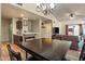 Dining area with a dark wood table and chairs, located near the kitchen at 2035 S Elm St # 222, Tempe, AZ 85282