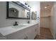 Double vanity bathroom with modern fixtures and a large mirror at 15270 W Taylor St, Goodyear, AZ 85338