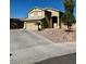 Two-story house with a beige exterior and a two-car garage at 15270 W Taylor St, Goodyear, AZ 85338