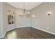 Elegant dining room features hardwood floors, chandelier, and wall sconces at 4055 N Smithsonian Dr, Florence, AZ 85132