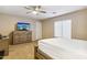 Cozy bedroom with a dresser and a comfortable bed at 46057 W Dutchman Dr, Maricopa, AZ 85139