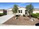 One story home with two car garage and desert landscaping at 48308 N Basilio St, Gold Canyon, AZ 85118