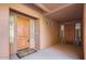 Shared entryway with two wood doors and neutral-colored walls at 13600 N Fountain Hills Blvd # 504, Fountain Hills, AZ 85268