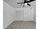 Bright bedroom with double door closet and ceiling fan at 9645 N 32Nd St, Phoenix, AZ 85028