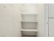 Small pantry with wire shelving and white walls at 6730 W Monterosa St, Phoenix, AZ 85033