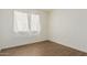 Bedroom with tile floors and window with curtains at 6730 W Monterosa St, Phoenix, AZ 85033