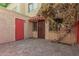 Private patio with brick pavers and a red door at 6730 W Monterosa St, Phoenix, AZ 85033
