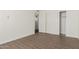 Bedroom with tile floors and double door closet at 6730 W Monterosa St, Phoenix, AZ 85033