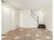 Living room featuring tile floors and a staircase at 6730 W Monterosa St, Phoenix, AZ 85033