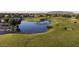 Golf course with pond and mountain views at 34 N Agua Fria Ln, Casa Grande, AZ 85194