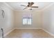 Bright bedroom with plantation shutters and ceiling fan at 126 S Lucia Ln, Casa Grande, AZ 85194