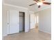 Bedroom with sliding door closet and access to hallway at 126 S Lucia Ln, Casa Grande, AZ 85194