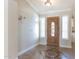 Inviting entryway with tiled floor and elegant wood door at 126 S Lucia Ln, Casa Grande, AZ 85194