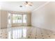 Bright living room with tile floors and bay window at 126 S Lucia Ln, Casa Grande, AZ 85194