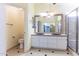 Bathroom with double vanity, shower and toilet at 126 S Lucia Ln, Casa Grande, AZ 85194
