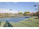 Tennis court with a net and lighting at 126 S Lucia Ln, Casa Grande, AZ 85194