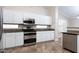 Kitchen with granite countertops and white cabinetry at 126 S Lucia Ln, Casa Grande, AZ 85194