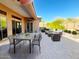 Relaxing patio featuring comfortable seating and dining areas at 42023 N Bridlewood Way, Phoenix, AZ 85086