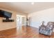 Living room with hardwood floors and a comfy chair at 2308 N Gayridge Rd, Mesa, AZ 85215