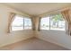 Bedroom with golf course view and neutral colored carpet at 2308 N Gayridge Rd, Mesa, AZ 85215