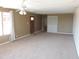 Spacious living room with carpeted floors and a view of the entryway at 1411 N Overfield Rd, Casa Grande, AZ 85194