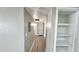 Light and bright hallway with wood-look flooring and built-in shelving at 2633 W Ocotillo Rd # 3, Phoenix, AZ 85017