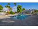 Community pool with surrounding patio and trees at 2633 W Ocotillo Rd # 3, Phoenix, AZ 85017