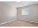 Simple bedroom with wood-look floors and window at 2633 W Ocotillo Rd # 3, Phoenix, AZ 85017