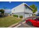 Two-story building with attached garages, guest parking, and a pool at 2633 W Ocotillo Rd # 3, Phoenix, AZ 85017