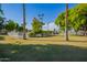Expansive grassy area with mature trees and a pool at 2633 W Ocotillo Rd # 3, Phoenix, AZ 85017